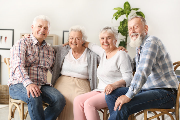 residents in respite care together in a nursing home all smiling
