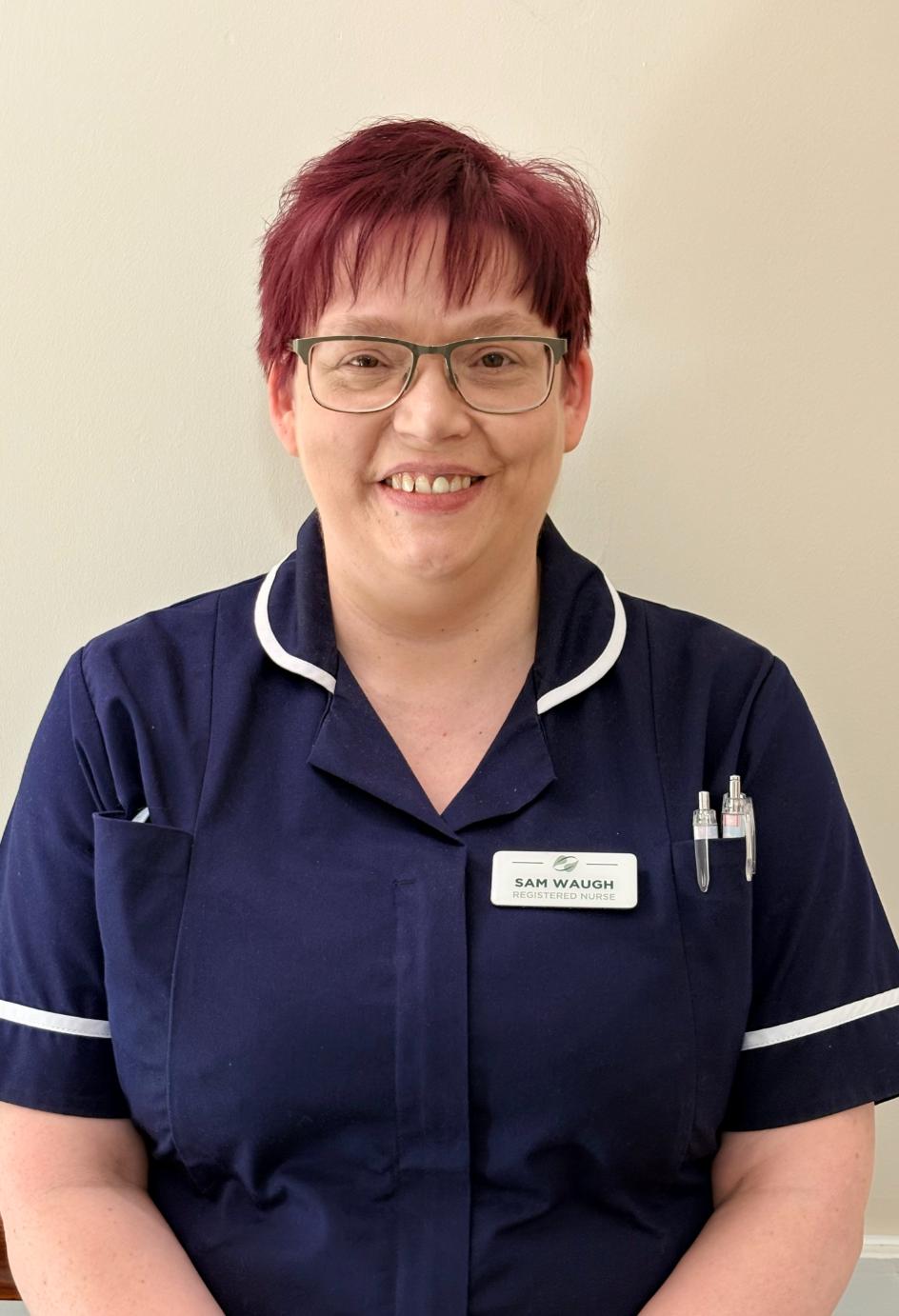 lady posing for staff photo