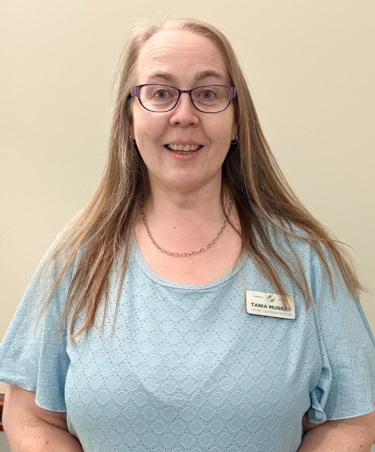 lady posing for staff photo